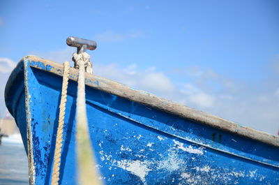 Close-up of boat against blue sky