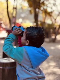 Rear view of girl looking at nature