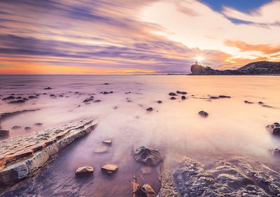 Scenic view of sea against sky during sunset