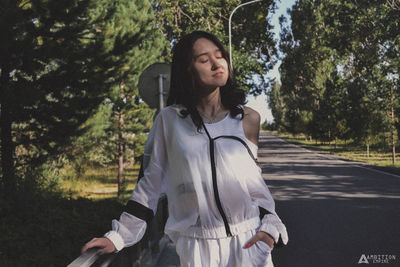 Full length of teenage girl standing on road