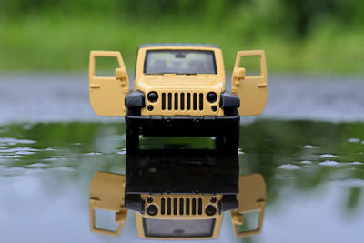 Close-up of toy car on lake