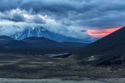 Scenic view of mountains against sky during sunset