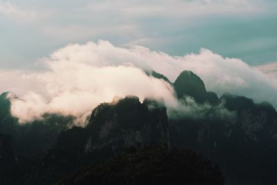 Smoke emitting from volcanic mountain against sky