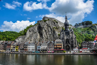 Buildings by lake in town