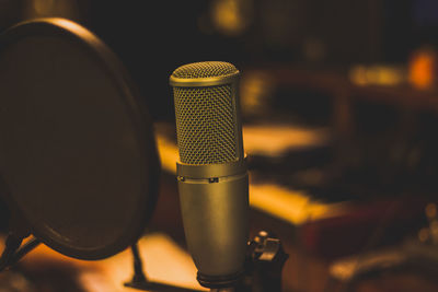 Close-up of microphone and soundproof in recording studio