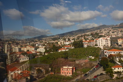 High angle shot of townscape against sky