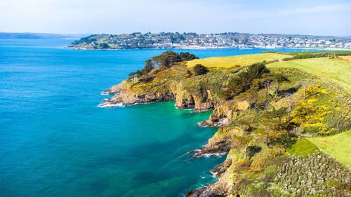 Scenic view of tropical coastline against sky