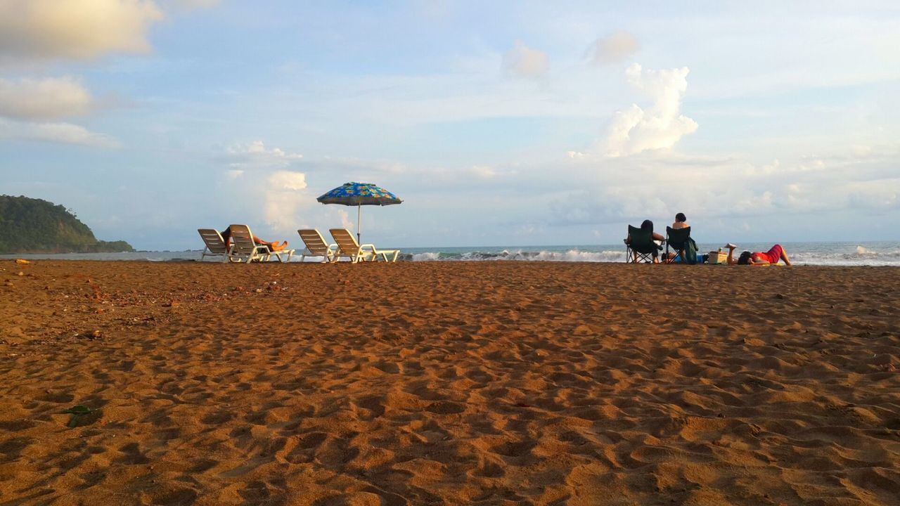 beach, sand, sea, shore, sky, horizon over water, water, vacations, lifestyles, leisure activity, large group of people, scenics, tranquil scene, person, tranquility, men, nature, cloud - sky, beauty in nature