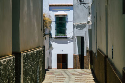 Alley amidst buildings in city