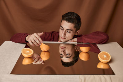 Portrait of man holding ice cream