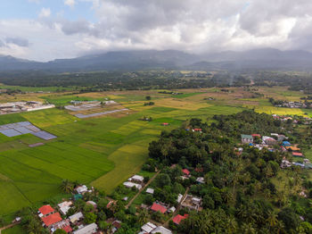 Aerial view of agricultural field against sky