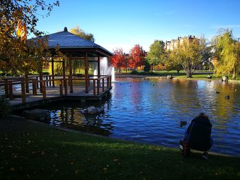 Built structure by trees against sky