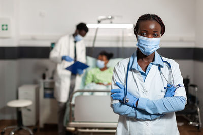 Portrait of doctor wearing mask in hospital