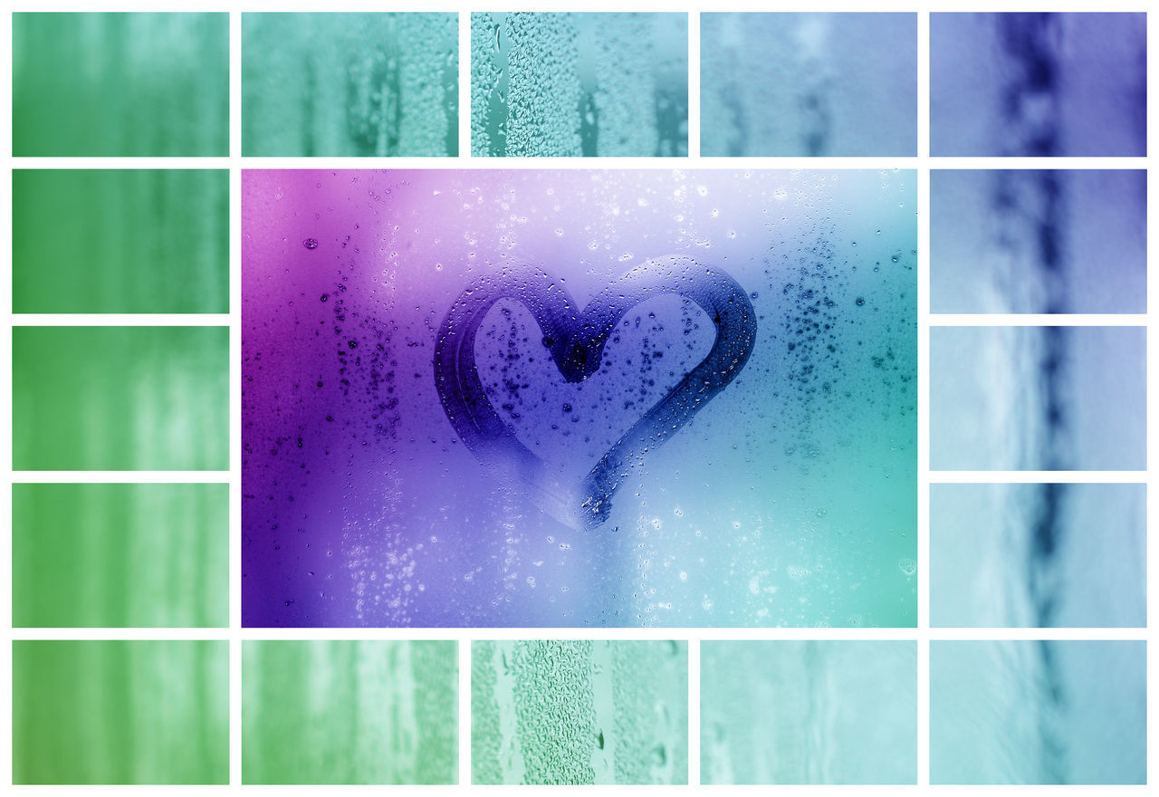 CLOSE-UP OF HEART SHAPE ON GLASS AGAINST BLUE BACKGROUND