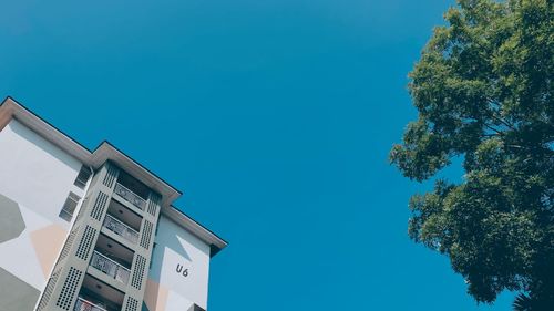 Low angle view of building against clear blue sky