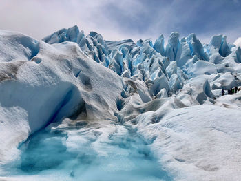 Scenic view of glacier against sky