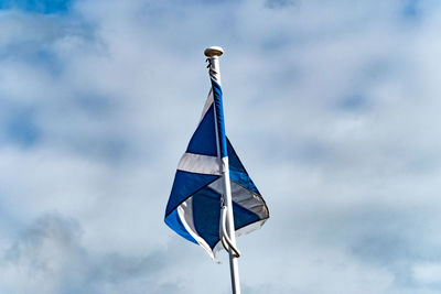 Low angle view of flag against sky