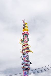 Low angle view of decoration hanging against sky