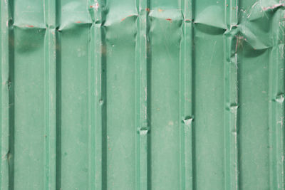 Full frame shot of green metal fence