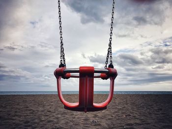 View of swing hanging on beach