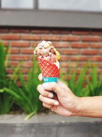 Hand holding ice cream cone