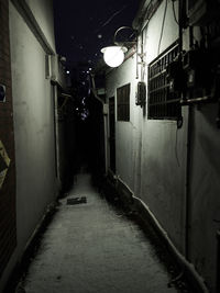 Empty alley amidst buildings