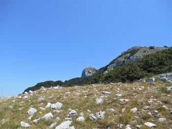 Scenic view of mountain against clear blue sky