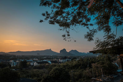 View of townscape against sky at sunset