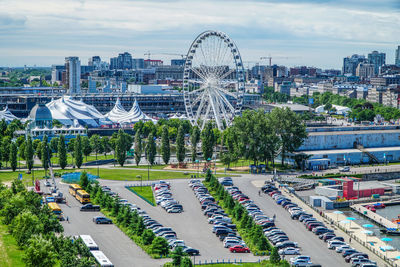 High angle view of ferris wheel in city