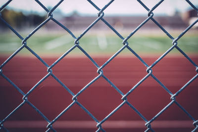 Chainlink fence seen through chainlink fence