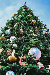 Low angle view of christmas tree against sky