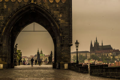 People on charles bridge in city