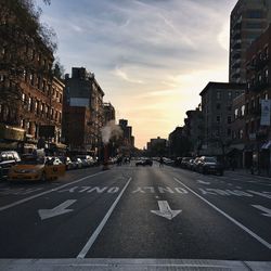 City street against cloudy sky