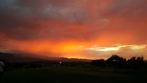 Scenic view of landscape against sky during sunset