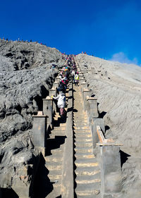 High angle view of people against clear blue sky