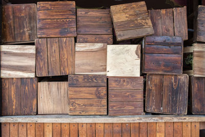 Full frame shot of wooden stools for sale at market