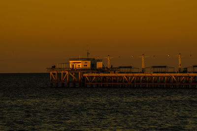 Scenic view of sea against clear sky during sunset