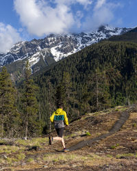 Trail running on a scenic alpine mountain trail in british columbia.