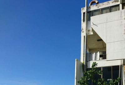 Low angle view of built structure against blue sky