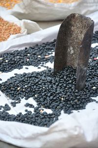 Close-up of black lentils at market stall for sale