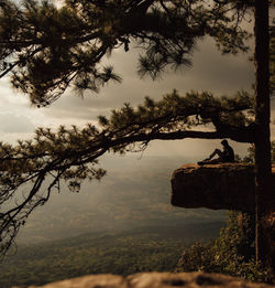 Scenic view of lake against sky at sunset