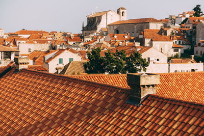 Houses in town against clear sky