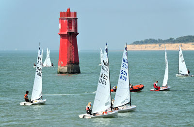 Sailboat on sea against sky