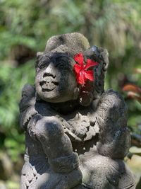 Close-up of statue against plants