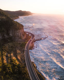 High angle view of road by sea against sky