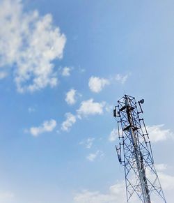 Low angle view of electricity pylon against sky