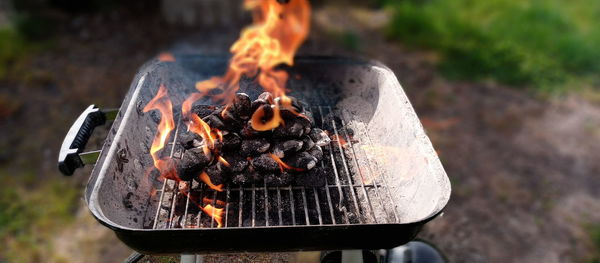 Close-up of bonfire on barbecue grill