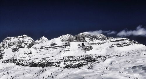 Scenic view of snow covered mountains