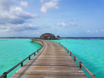 Pier over sea against sky