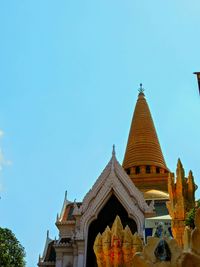 Low angle view of temple against clear blue sky